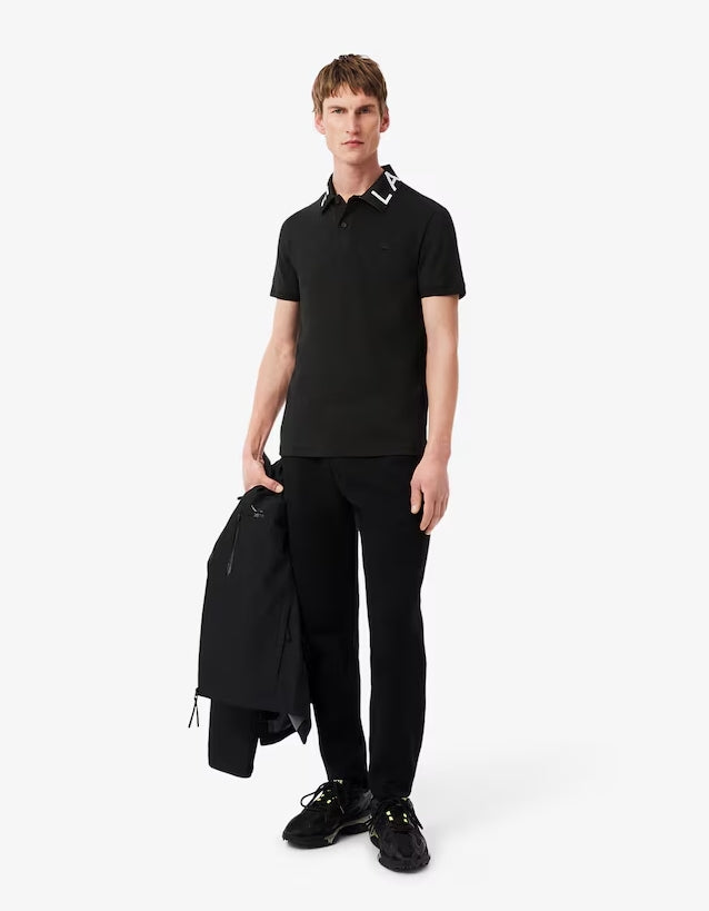 POLO CUELLO LETRAS - LACOSTE