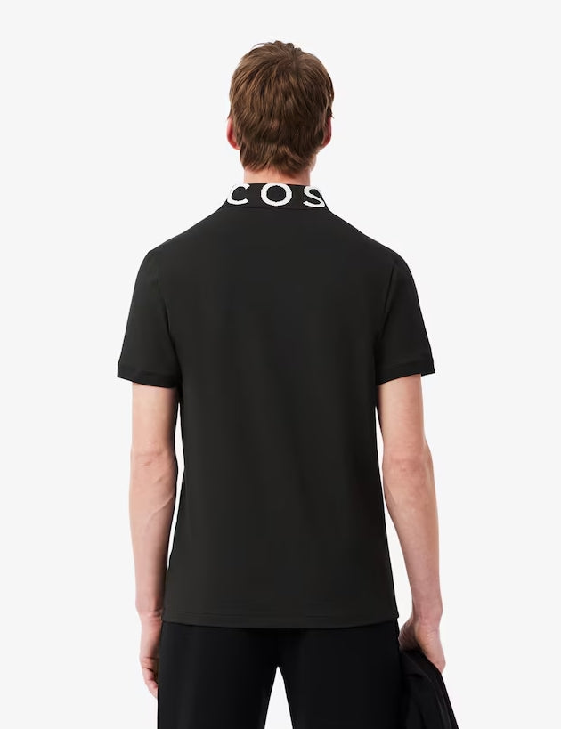 POLO CUELLO LETRAS - LACOSTE