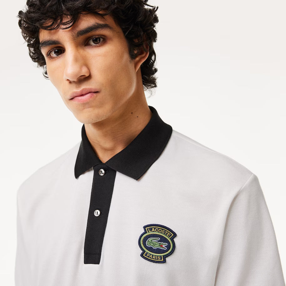 POLO BLANCO CUELLO NEGRO - LACOSTE