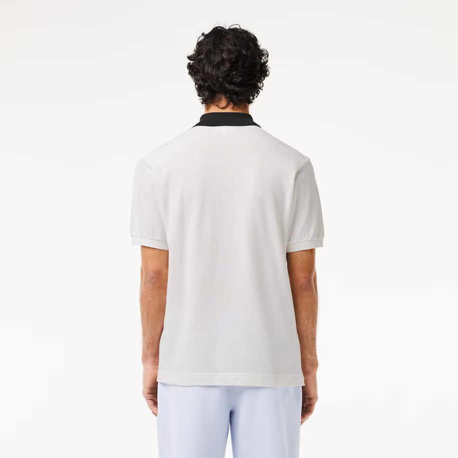 POLO BLANCO CUELLO NEGRO - LACOSTE